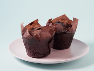 Chocolate cupcakes with cherry jam isolated on a white background. Chocolate muffin. High quality photo