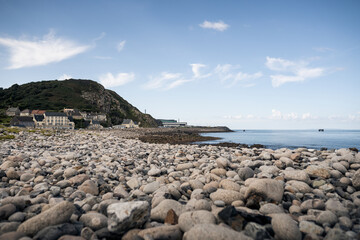 Rocks and stones on the beach in Normandy, France.
