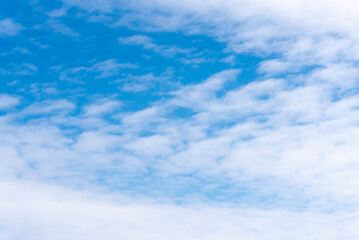 Small pieces of White clouds in summer blue sky
