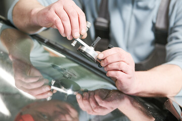 automobile windshield glass repair service. Car glass or chip crack repairing