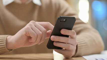 Close up of Young Man Using Smartphone 