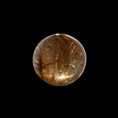 Ball of quartz with rutile on a black background