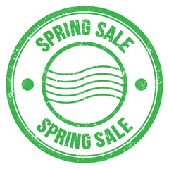 SPRING SALE text written on green round postal stamp sign