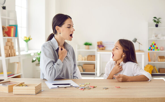 Speech-language pathologist working on child's pronunciation problems. Speech therapist teaching kid correct sound articulation, helping fix stuttering stammering impediment and boost self confidence