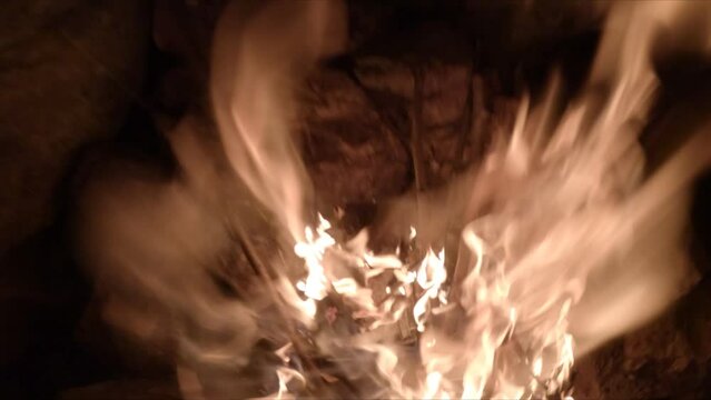 super slow motion of a fire in the mountains in the night