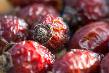 Dry berries of rosehip close-up. Dry fruits prepared for aromatic and curative tea, includes antioxidants.