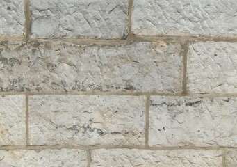 Détail d'un mur traditionnel de pierres taillées et maçonnées