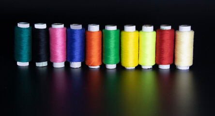 Colorful yarn on spool, yarn on tube, cotton, wool, linen thread, polyester like rain bow