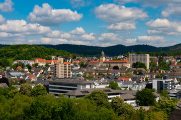 Panoramic view over city of Arnsberg Sauerland with buildings of district government “Bezirksregierung“. Ruhr valley seen from Tower of Wedinghausen monastery on a sunny spring day in Germany.