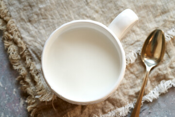 Obraz na płótnie Canvas Probiotic kefir in a white cup on a table