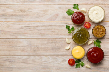 Many different sauces and herbs on table, flat lay top view. sauces with spices healthy concept