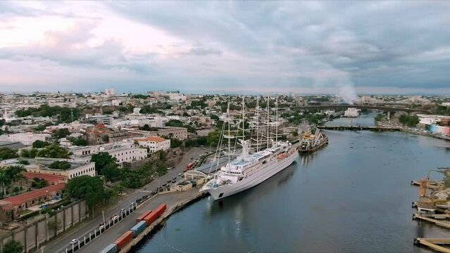 MSY Wind Surf ship moored in Colonial zone port at Santo Domingo in Dominican Republic. Aerial circling