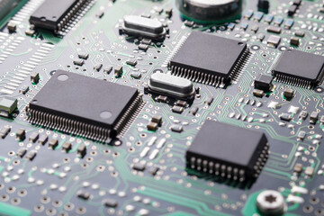 High tech technology background with printed circuit board PCB, chips and many electronic...