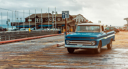 classic American brand pickup truck on the iconic Stearns Wharf, in Santa Barbara, California, USA  - obrazy, fototapety, plakaty