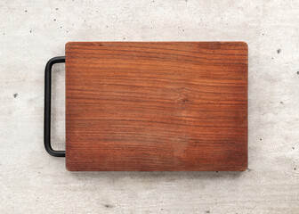 Empty wooden board over wooden table with copy space