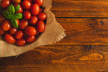 Red Cherry Tomatoes on wooden background