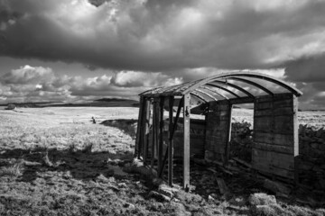 Grayscale shot of the abandoned railway wagon. Melkridge, Northumberland, England