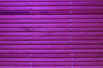 Closeup shot of the purple bamboo mat texture background