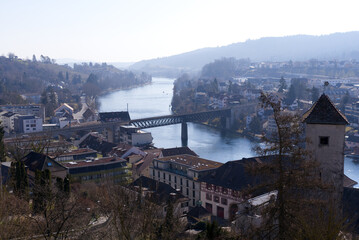 Fototapeta na wymiar Aerial view over City of Schaffhausen with Rhine River and bridge seen from historic fortification named Munot on a sunny spring day. Photo taken March 5th, 2022, Schaffhausen, Switzerland.