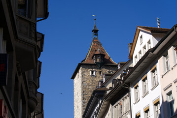 Fototapeta na wymiar Historic stone tower named Obertor (upper gate) at the old town of Schaffhausen on a sunny spring day. Photo taken March 5th, 2022, Schaffhausen, Switzerland.