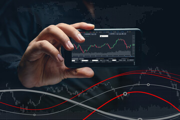 Hand of business man holding smart phone show application stock graph on display. Investment man trade with cellphone global system network concept.