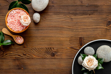 Relax background - spa stones with roses and sea salt, top view