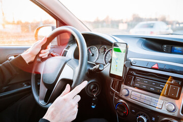 Gps device map system. Global positioning system on smartphone screen in auto car on travel road....