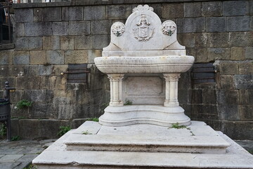 Fountain in Umberto square in Castelnuovo Garfagnana, Tuscany, Italy