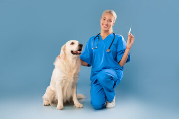 Nurse In Scrubs Uniform Posing With Dog Holding Syringe