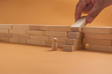 Hand arranging wood block stacking as step stair and close the gap to resolve the broken bridge...