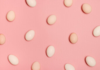 Pattern made of eggs on pastel pink background. Minimal food concept.