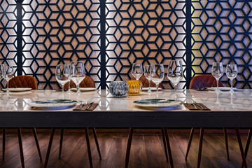 Banquet table with plates and wineglasses in restaurant