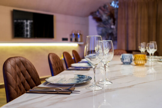 Trendy interior design of modern restaurant with served tables