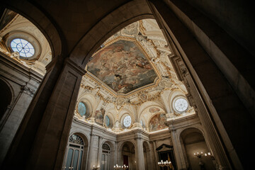 Low angle shot of the ornamented ceiling of the Royal Palace in Madrid, Spain