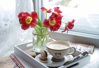 cup of coffee with tulips