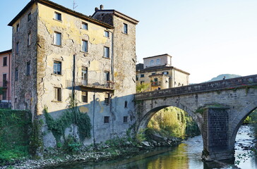 Fototapeta na wymiar Madonna bridge over the Turrite Secca stream in Castelnuovo Garfagnana, Tuscany, Italy
