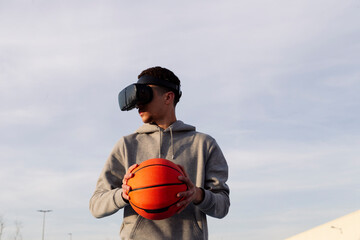 Man in VR headset playing basketball