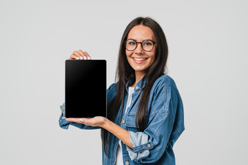 E-learning e-banking. Smart caucasian young woman holding showing digital tablet blank screen for...