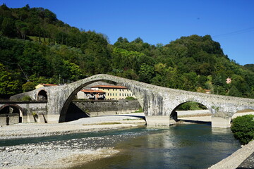 Fototapeta na wymiar Maddalena bridge, called of the devil, in Borgo a Mozzano in Garfagnana, Tuscany, Italy