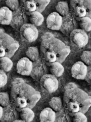 black and white pattern of teddy bears with bow on black concrete background