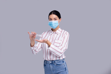 Girl Wearing Medical Mask Isolated. Girl Using Hands Sanitizer. Health, Virus, Medical Concept Isolated