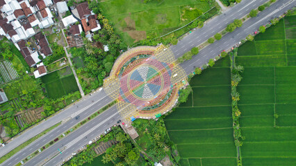 Aerial view of the city colorful Monument Tembolak Rainbow on Mataram. The newest icon from the city of Mataram Indonesia. Lombok, Indonesia, March 22, 2022