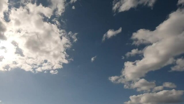 Clouds passing through a blue sky