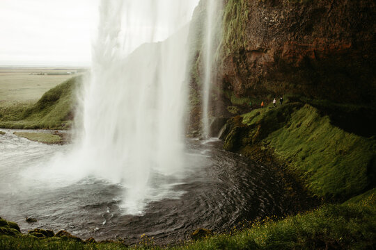 A Waterfall in Iceland Flowing into a Pond