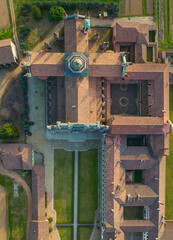 Birds view of the Certosa di Pavia, built in the late fourteenth century, courts and the cloister of the monastery and shrine in the province of Pavia, Lombardia, Italy