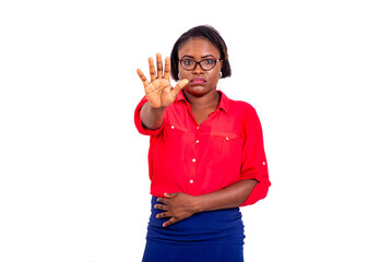 young disgruntled businesswoman making stop gesture with hand.