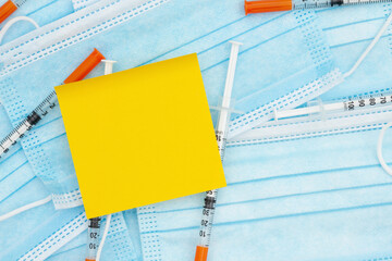 Disposable surgical face mask and needles with note