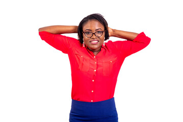 beautiful young businesswoman holding both hands behind her head smiling.