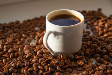 White cup with black coffee