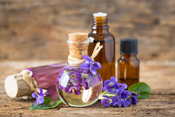 Violet essential oil in the bottle